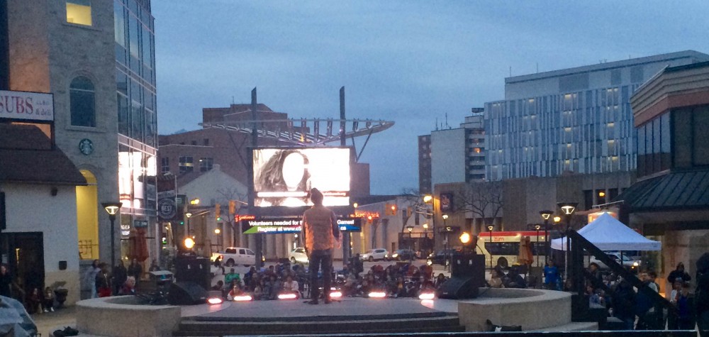 Spoken Word artist Chris Tse and the crowd at Garden Sqaue